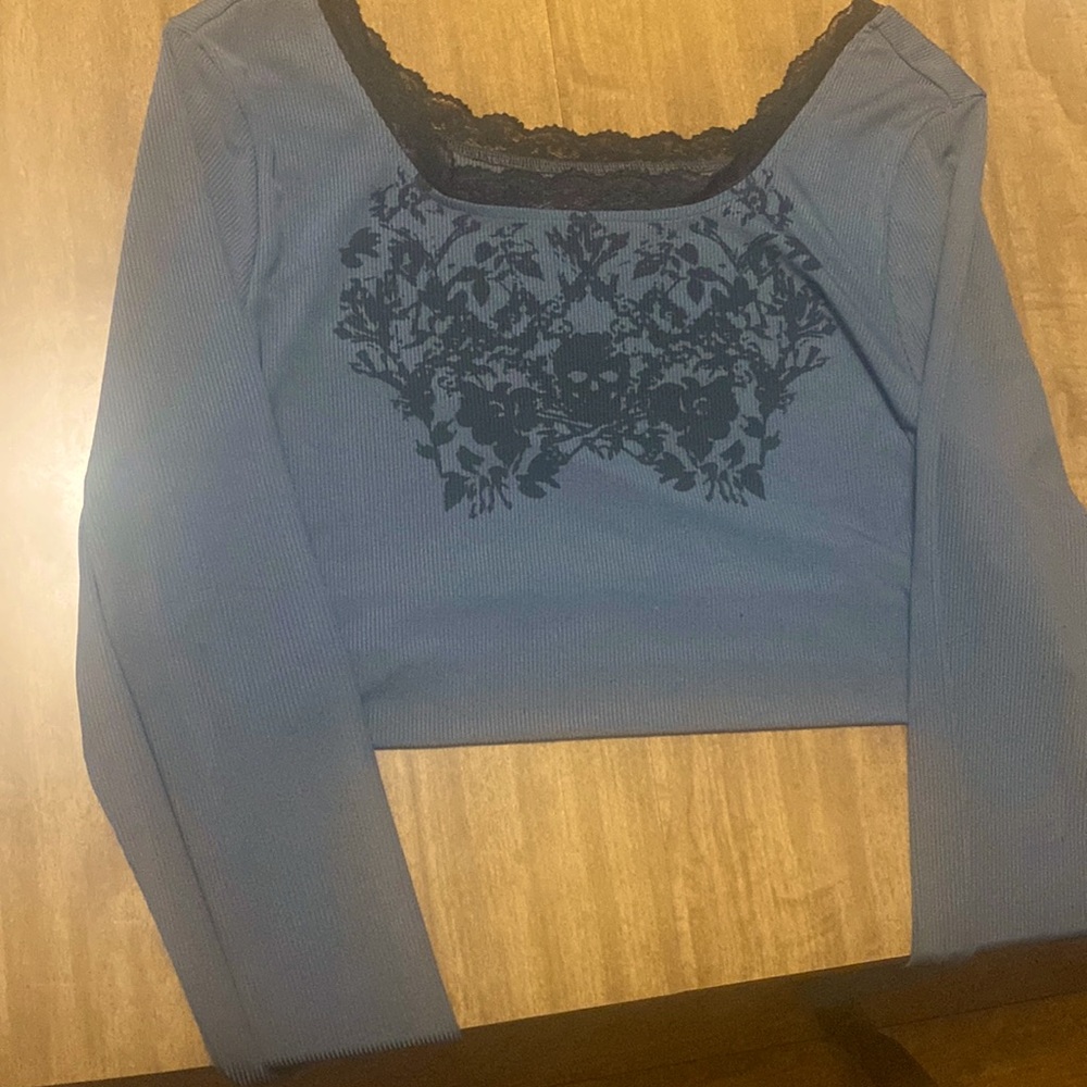 grey/black cropped long sleeve top with scull designs. brand: shein. size: xl